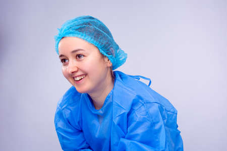 Medical sister is smiling very happy because of completed work in the hospital and she can rest a little.の写真素材