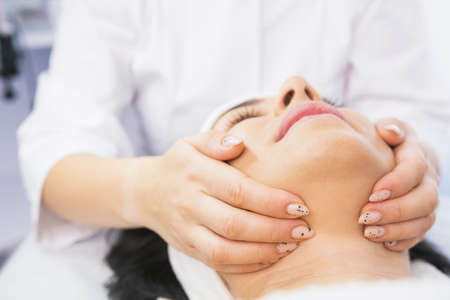 Close-up photo of woman getting facial hydro microdermabrasion peeling treatment in cosmetic beauty spa clinic.の写真素材