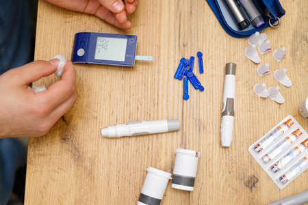 Top view photo of sugar measuring set on the table for checking blood sugar level for a man single, healthcare and diabetes.の写真素材