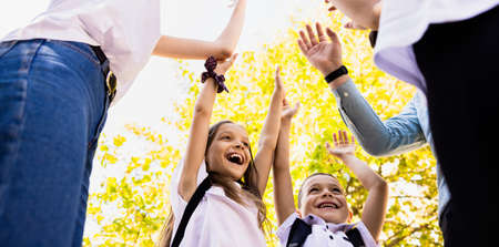 The students are happy that school is starting, a new school year, they have a big smile on their faces.の写真素材