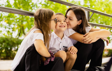 Kids love, first kiss. Back to school. Schoolchild friends back to school at knowledge day.