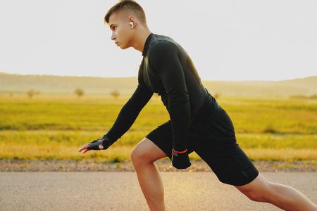Man athlete running on the nature at sunset. Health activities for healthy lifeの写真素材