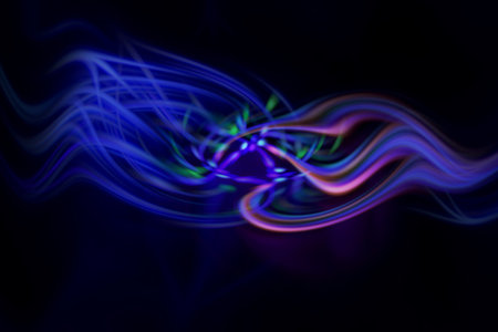 Illustration of many colorful neon light trails on a black background
