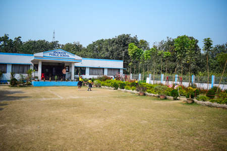 Malda, India- February 2nd, 2019: A kindergarten school building with a playground in front of itのeditorial素材