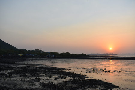 Sunset in th port of mumbai just beside the ocean.