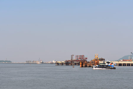 A image of a oil rig in middle of the ocean in far distance