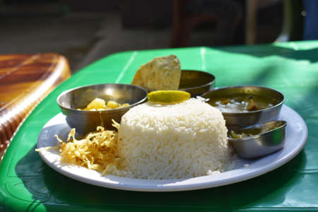 Bengali food thali with rice chips and vegetablesの写真素材