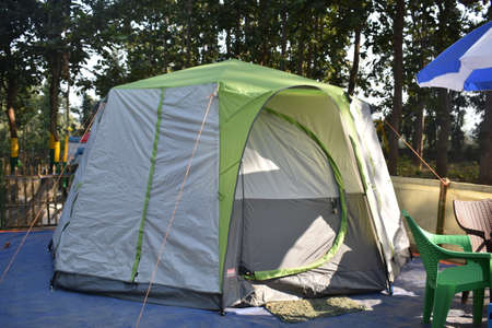 Closeup image of a tent in between a forestの写真素材