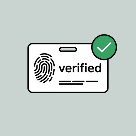 A simple graphic depicts a white ID card with a black outline.  The card features a black fingerprint icon and the word "verified" in black text.  Three thin black lines are below the text. A green circle with a white checkmark is positioned to the upper right of the card. The background is a light gray. The style is minimalist and flat.のイラスト素材