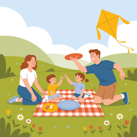 A family enjoys a picnic on a checkered blanket in a grassy park with a kite flying above.のイラスト素材