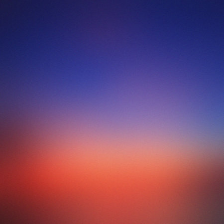 Abstract gradient background transitioning from deep blue to vibrant orange and red hues.の写真素材
