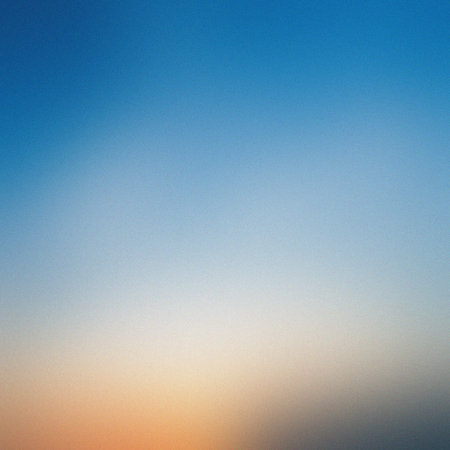 A smooth gradient of blue transitioning to faint warm tones at the bottom. Clear details and vibr...の写真素材