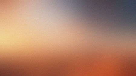 Soft gradient transitioning from warm yellow to grey and blue with subtle grain. Clear details an...の写真素材