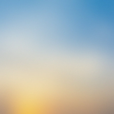 A soft gradient of blue and yellow fills the frame with a subtle grainy texture. Clear details an...の写真素材