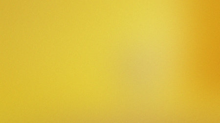 Bright yellow and orange gradient with a subtle grain texture creates a vibrant abstract background.