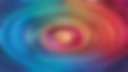 Concentric circles of blue, pink, and orange colors create a vibrant abstract pattern.の写真素材