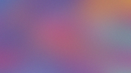 A muted, blurred gradient background featuring pink, purple, and orange tones with subtle grain.の写真素材