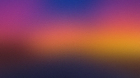 Smoothly blurred gradient with vibrant transitions from deep purple to yellow and orange.