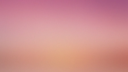 A softly blurred gradient background featuring gentle pink and peach color transitions.の写真素材