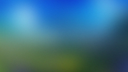 A vibrant blue sky blends into earthy green tones in this soft, blurred abstract background.