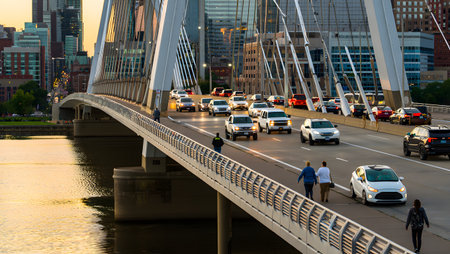 Image showing suspension bridge traffic and pedestrians at sunset. High resolution image...の写真素材
