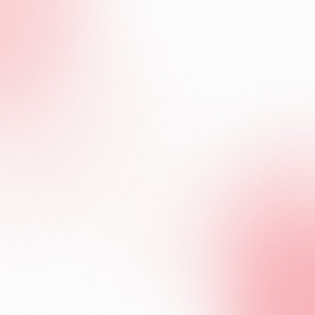 A gentle, blurred gradient background with soft transitions from white to light pink.の写真素材
