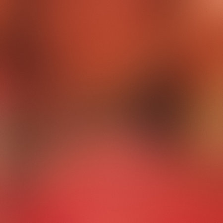 A softly blurred abstract background with warm red, brown, and orange tones. Clear details and vi...の写真素材