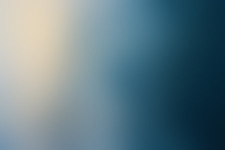 A soft focus gradient transitioning from light yellow to deep blue, creating depth.の写真素材