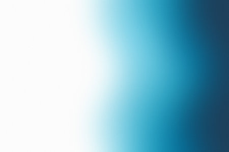 A smooth gradient abstract background transitioning from deep blue to white with soft edges.の写真素材