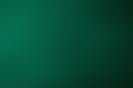 A deep emerald green gradient fades into black with a subtle textured effect. Clear details and v...の写真素材