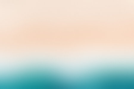 A smooth gradient blending soft peach tones into a calming teal color, creating a serene backdrop.の写真素材