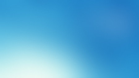 A bright blue gradient background with a soft white light effect on the left. Clear details and v...の写真素材