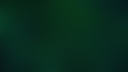 A dark green gradient background with a subtle textured effect and soft light. Clear details and ...の写真素材