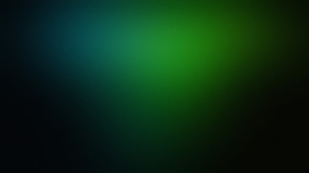 A dark teal and green gradient background with soft, diffused light and smooth transitions.の写真素材