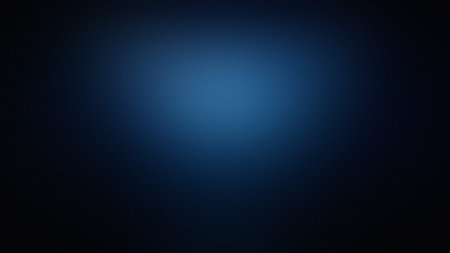 A dark blue gradient background with a subtle central light spot and soft texture. Clear details ...の写真素材