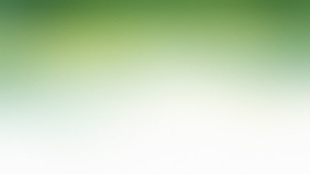 A soft gradient transitioning from light green to white with a fine grain texture. Clear details ...の写真素材