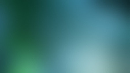 A blurred gradient of deep teal and blue with subtle green undertones forms a serene backdrop.の写真素材