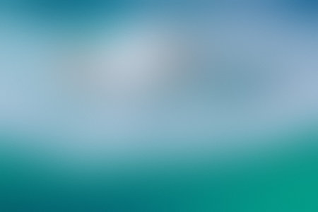 A soft gradient blending teal and light blue with a bright, blurred center area. Clear details an...の写真素材