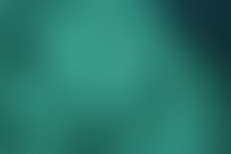 A soft, blurred gradient of teal green with subtle light variations. Clear details and vibrant co...の写真素材
