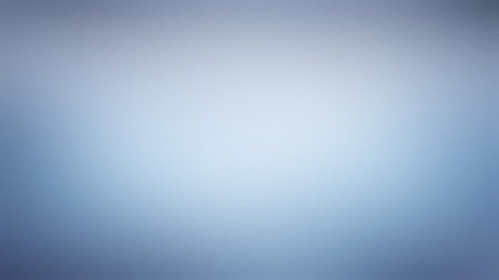 A soft, light blue and white gradient with a subtle texture provides a clean, airy backdrop.の写真素材