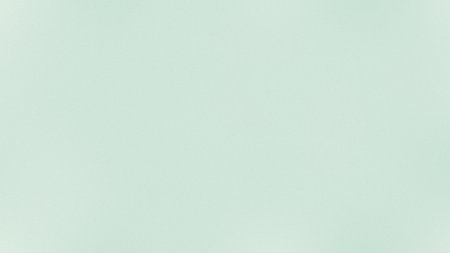 A plain, pale mint green background with a subtle textured surface. Clear details and vibrant col...の写真素材