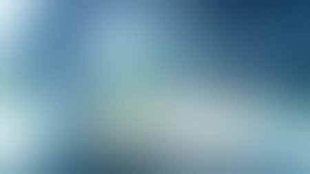 A smooth gradient background transitions from light blue to white with a frosted glass texture...の写真素材