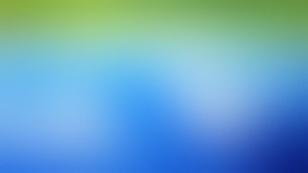 A soft gradient transitions from green at the top to blue at the bottom with a blurred effect.の写真素材