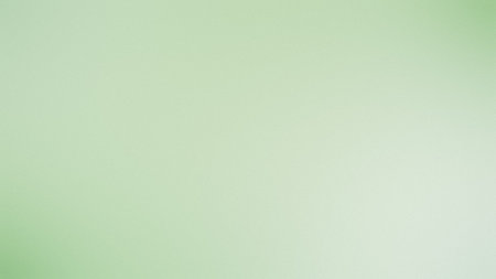 A soft, pale green gradient background with a subtle texture and gentle lighting. Clear details a...の写真素材