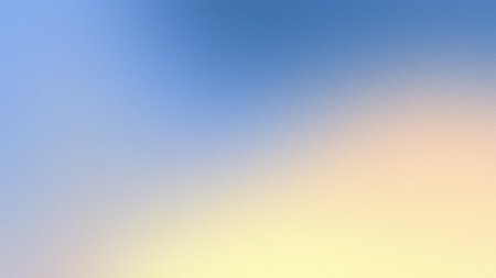 A soft gradient transitions from light blue at the top to pale yellow at the bottom.の写真素材