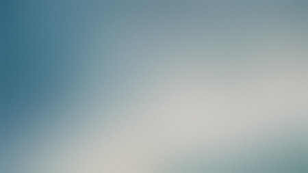 A soft blue and white gradient with a subtle blur creates a light and airy backdrop.の写真素材