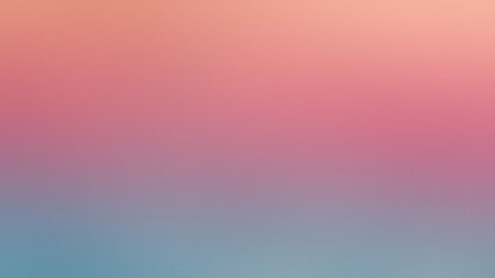 A smooth gradient transitions from soft pink and orange at the top to light blue at the bottom.の写真素材