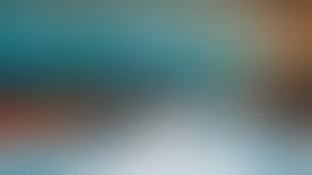 A soft blurred gradient background transitions from teal blue to brown and grey tones.の写真素材