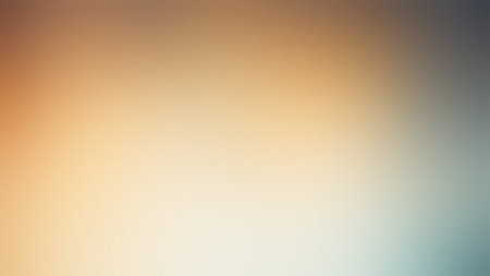 A warm orange and blue gradient background with a subtle texture and soft diffusion.の写真素材