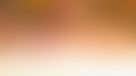 A warm beige and orange gradient background with a soft, blurred focus. Clear details and vibrant...の写真素材